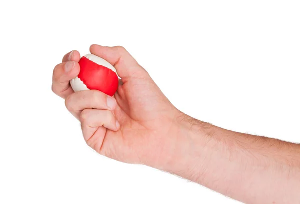 Mano masculina con una bola roja y blanca — Foto de Stock