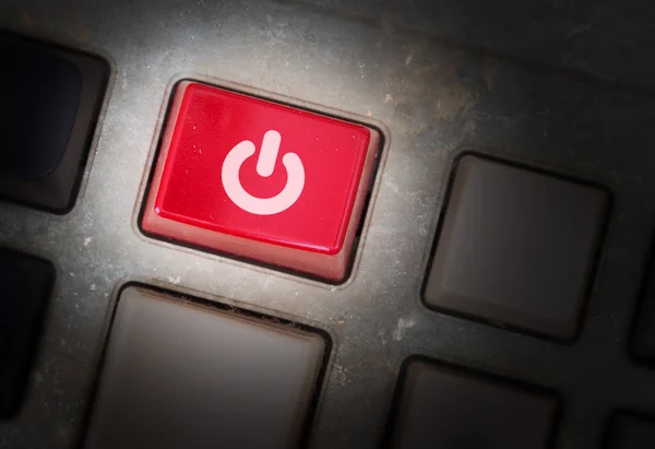 Red button on a dirty old panel — Stock Photo, Image