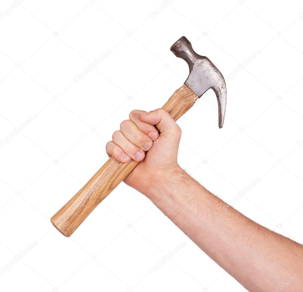 Man's hand holding hammer