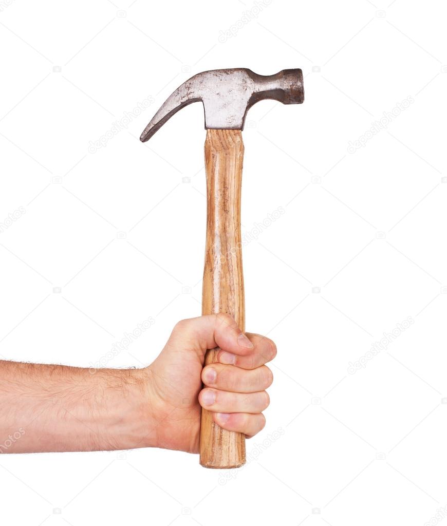 Man's hand holding hammer