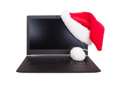 Modern açık laptop lcd köşede koymak kırmızı santa claus şapka ile