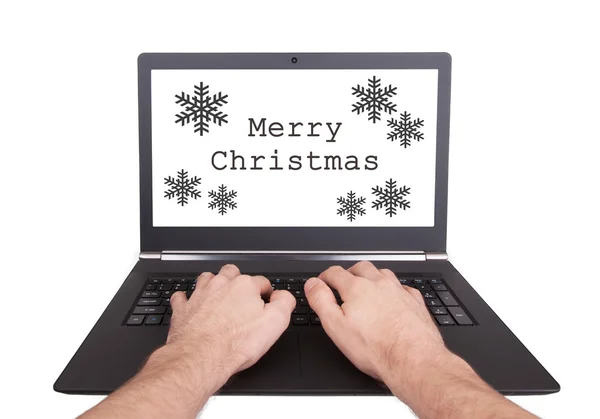 Uomo al lavoro sul computer portatile, buon Natale — Foto Stock