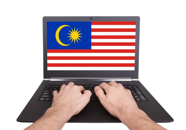 Hands working on laptop, Malaysia — Stock Photo, Image