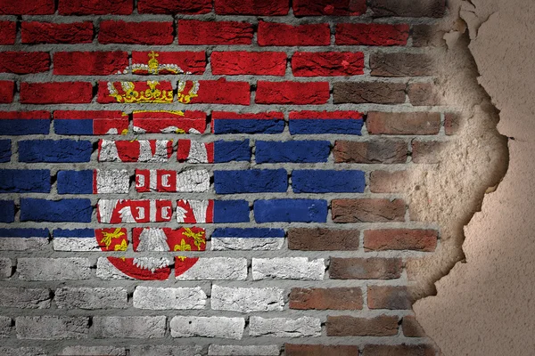 Donkere bakstenen muur met gips - Servië — Stockfoto