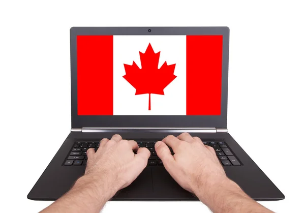 Hands working on laptop, Canada — Stock Photo, Image