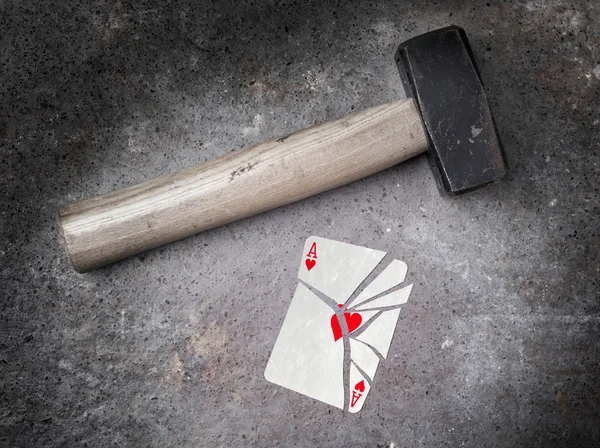 Hammer with a broken card, ace of hearts — Stock Photo, Image