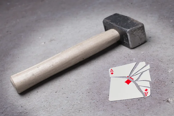 Hammer with a broken card, ace of diamonds — Stock Photo, Image