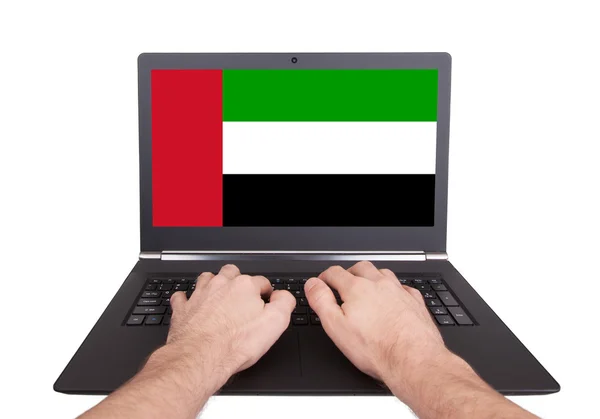 Hands working on laptop, UAE — Stock Photo, Image