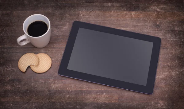 Tablet touch computer gadget on wooden table — Stock Photo, Image