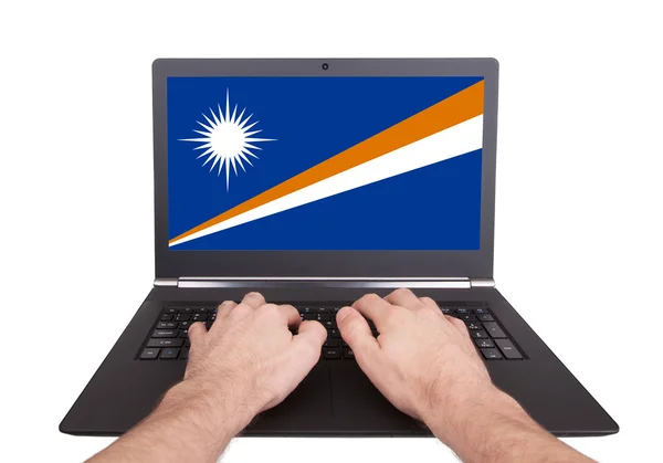 Hands working on laptop, Marshall Islands — Stock Photo, Image