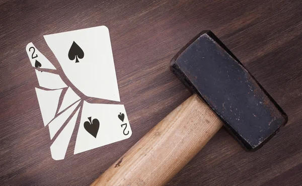 Hammer with a broken card, two of spades — Stock Photo, Image