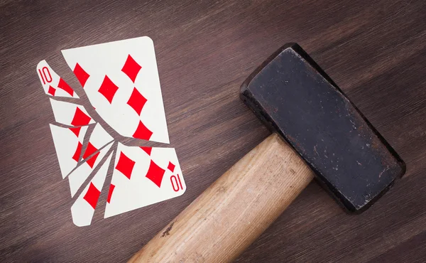 Hammer with a broken card, ten of diamonds — Stock Photo, Image