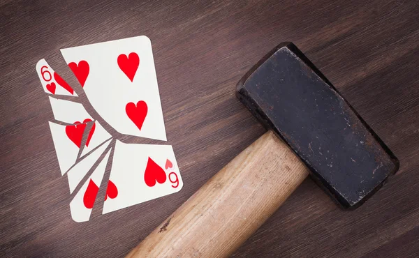 Hammer with a broken card, six of hearts — Stock Photo, Image