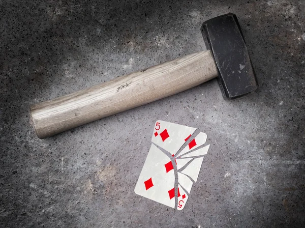 Hammer with a broken card, five of diamonds — Stock Photo, Image
