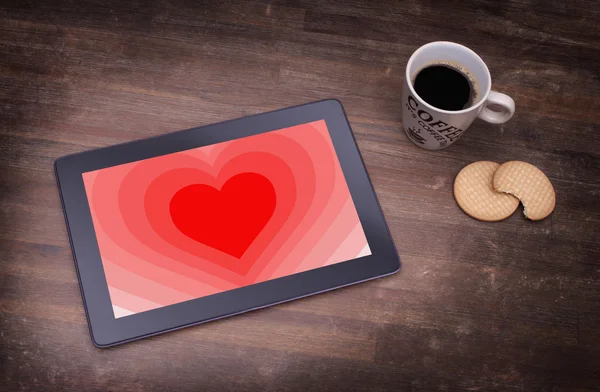 Heart shape backgound on tablet — Stock Photo, Image