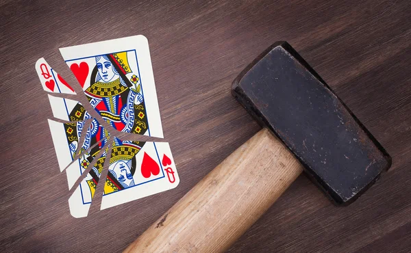 Hammer with a broken card, queen of hearts — Stock Photo, Image