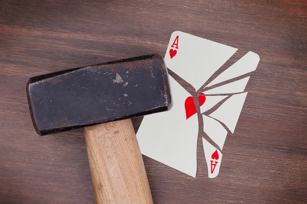 Hammer with a broken card, ace of hearts — Stock Photo, Image