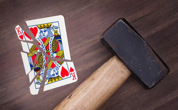 Hammer with a broken card, king of hearts — Stock Photo, Image