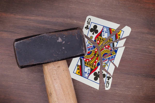Hammer with a broken card, queen of clubs — Stock Photo, Image