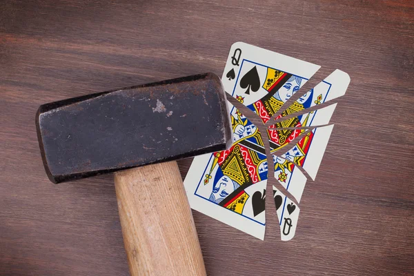 Hammer with a broken card, queen of spades — Stock Photo, Image