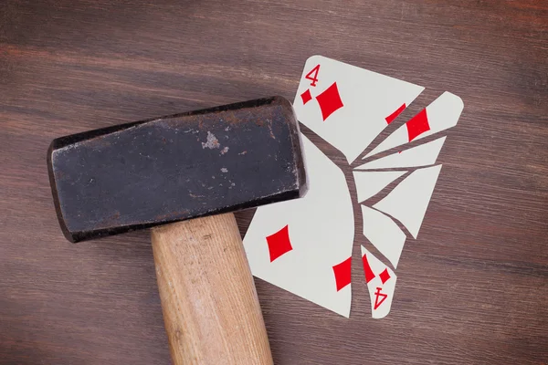 Hammer with a broken card, four of diamonds — Stock Photo, Image