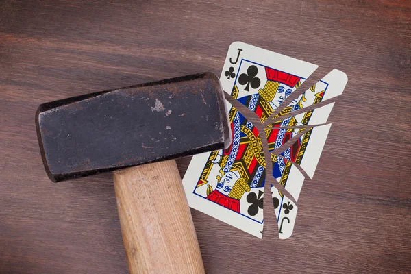 Hammer with a broken card, jack of clubs — Stock Photo, Image