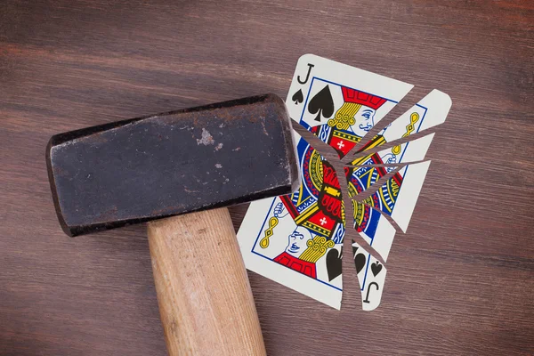 Hammer with a broken card, jack of spades — Stock Photo, Image
