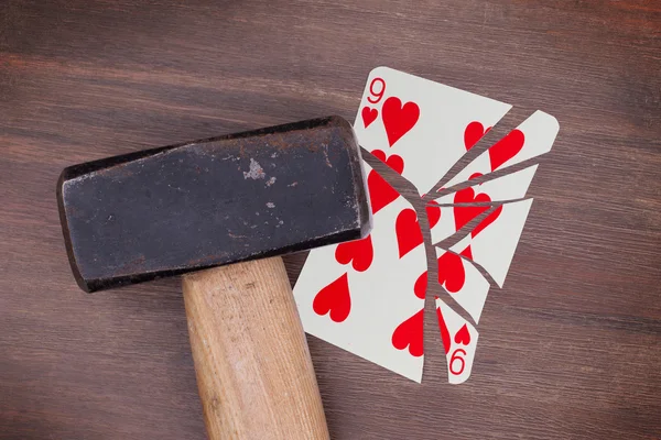 Hammer with a broken card, nine of hearts — Stock Photo, Image