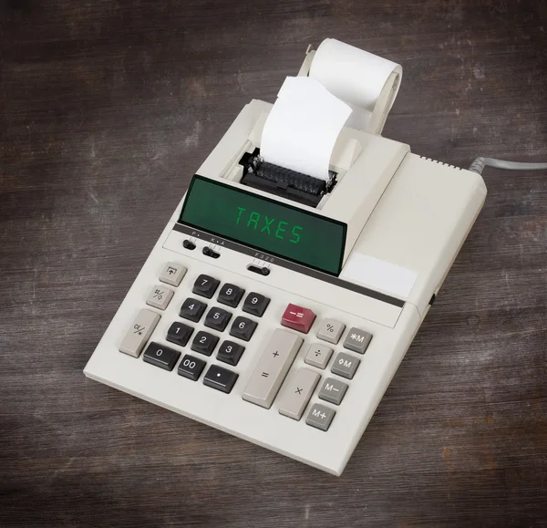 Old calculator - taxes — Stock Photo, Image