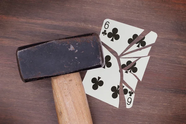 Hammer with a broken card, six of clubs — Stock Photo, Image