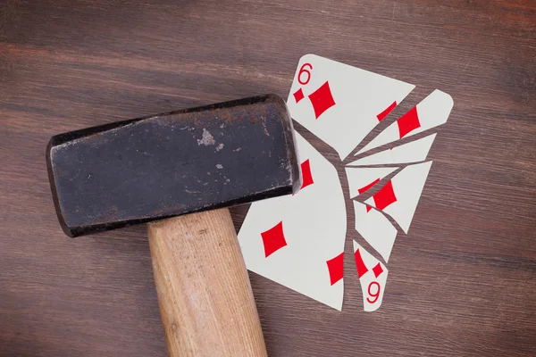 Hammer with a broken card, six of diamonds — Stock Photo, Image