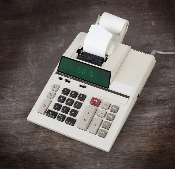 Old calculator showing a percentage - 50 percent — Stock Photo, Image