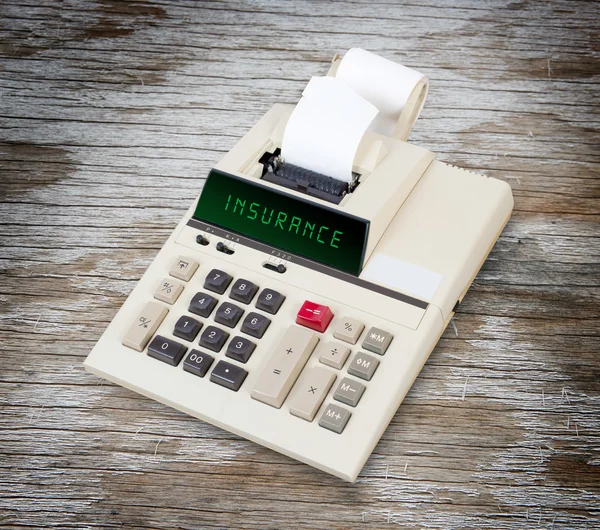 Old calculator - insurance — Stock Photo, Image