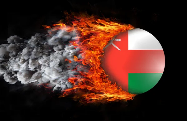 Flag with a trail of fire and smoke - Oman — Stock Photo, Image