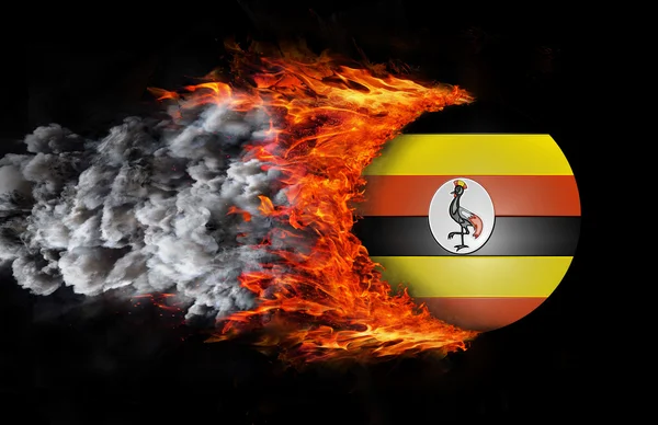 Flag with a trail of fire and smoke - Uganda — Stock Photo, Image