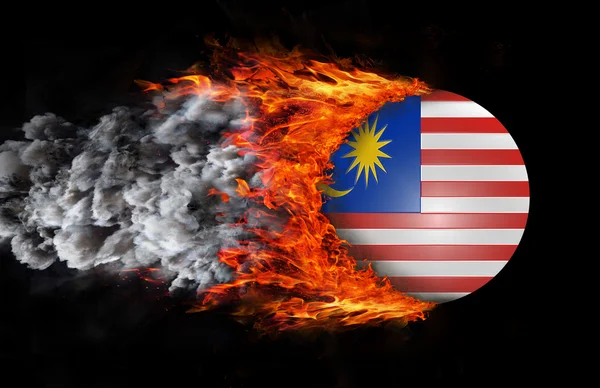 Bandeira com um rastro de fogo e fumaça - Malásia — Fotografia de Stock