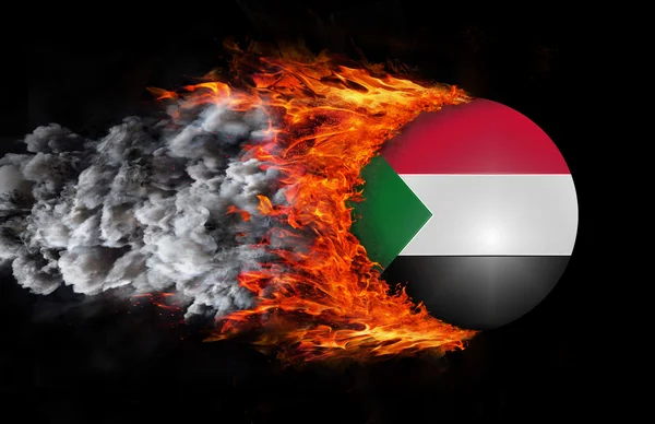 Flag with a trail of fire and smoke - Sudan — Stock Photo, Image