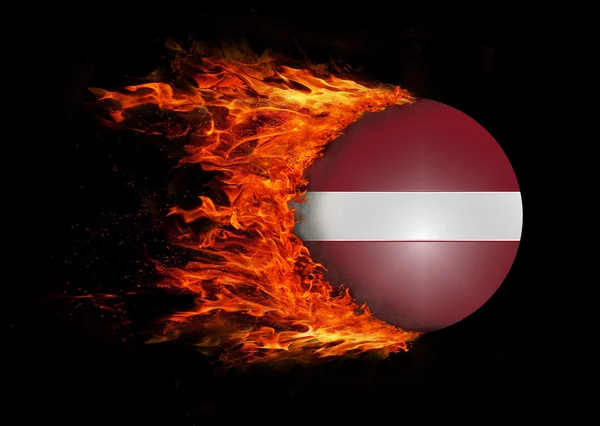 Flag with a trail of fire - Latvia — Stock Photo, Image