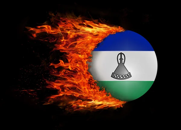 Flagge mit einer Spur von Feuer - lesotho — Stockfoto