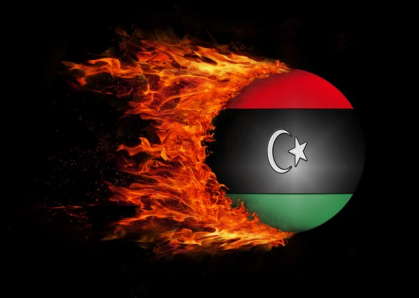 Flaga z szlak ognia - Libia — Zdjęcie stockowe