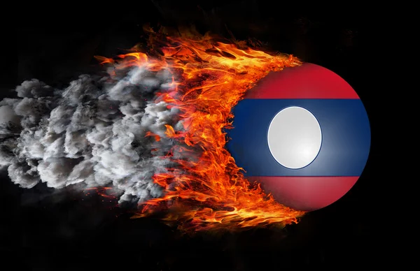 Flagga med ett spår av brand och rök - Laos — Stockfoto