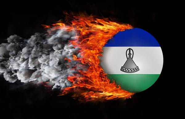 Bandera con un rastro de fuego y humo - Lesotho —  Fotos de Stock