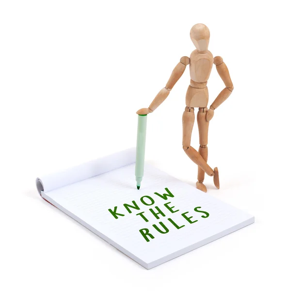 Mannequin en bois écrit dans le scrapbook - Connaître les règles — Photo