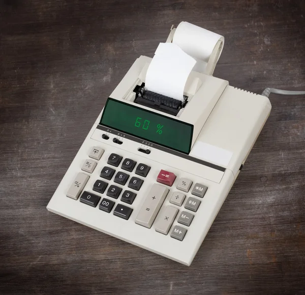 Old calculator showing a percentage - 60 percent — Stock Photo, Image