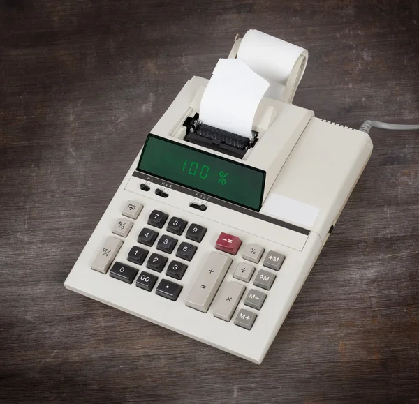 Old calculator showing a percentage - 100 percent — Stock Photo, Image