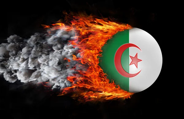 Flag with a trail of fire and smoke - Algeria — Stok fotoğraf