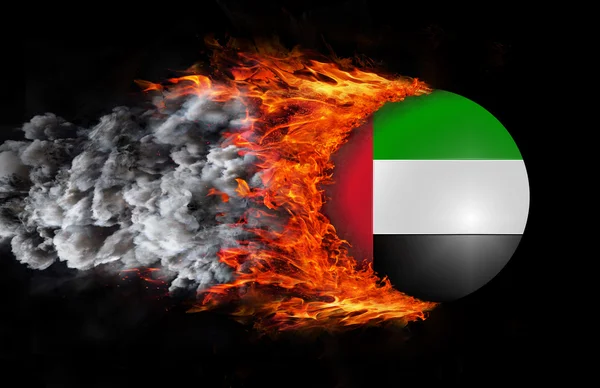 Flag with a trail of fire and smoke - United Arab Emirates — Stockfoto