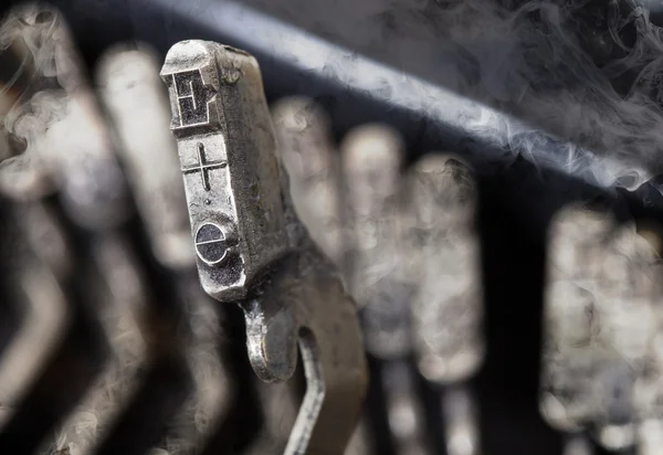 E hammer - old manual typewriter - mystery smoke — Stock Photo, Image