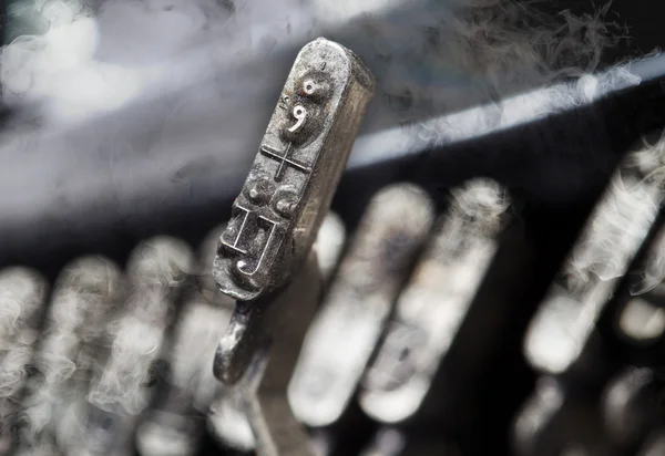 IJ hammer - old manual typewriter - mystery smoke — ストック写真