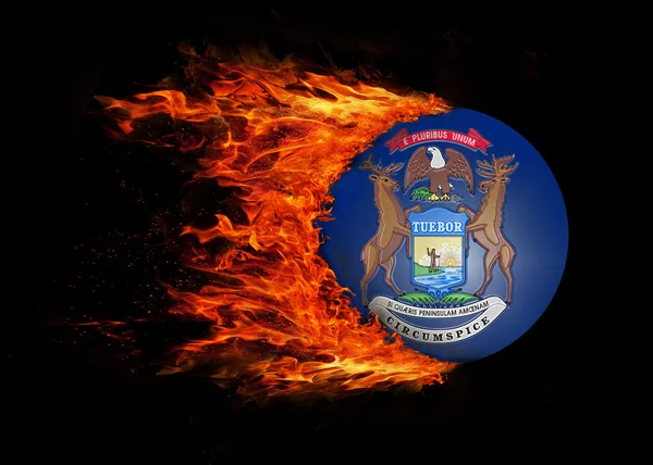 US state flag with a trail of fire - Michigan — Stock Photo, Image